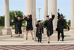 Photo of graduates celebrating. Link to Gifts That Pay You Income